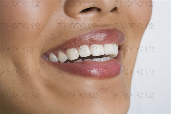 Close up of woman smiling.