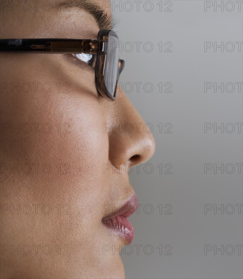 Profile view of woman wearing glasses.