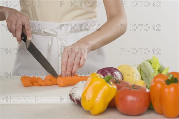 Woman chopping vegetables.