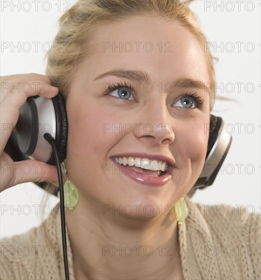 Young woman wearing headphones.