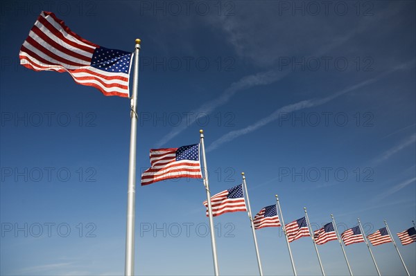 Flags around Washington Memorial Washington DC USA.