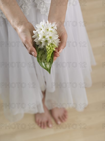 High angle view of woman holding flowers.