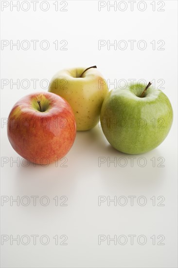 Assorted apples on table.