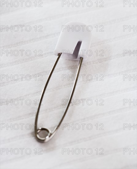 Close up of diaper pin.