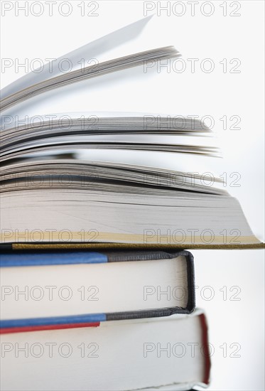 Close up of stack of books.