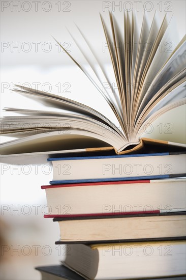 Close up of stack of books.