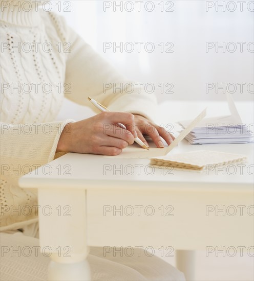 Woman writing cards.