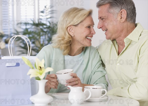 Senior couple having coffee.