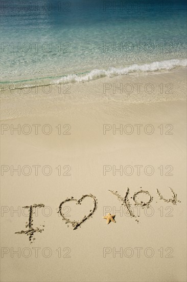 I Love You written in sand.
