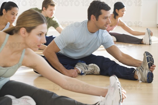 Group of people stretching.