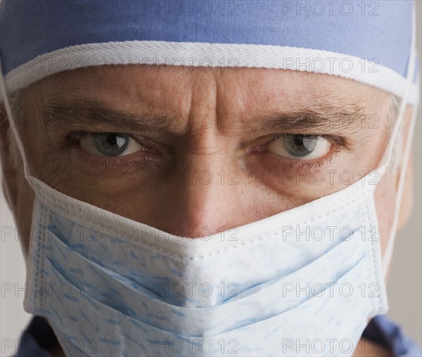 Close up of male doctor wearing surgical mask.