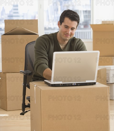 Businessman working in new office.