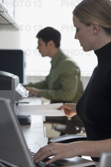 Businesspeople working at desks.