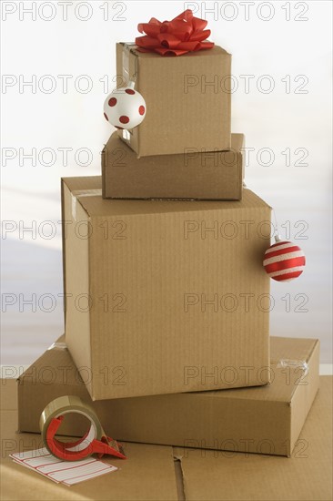 Shipping boxes with gift bow and Christmas ornaments.