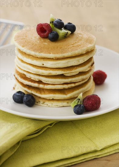 Breakfast plate with pancakes and fruit.