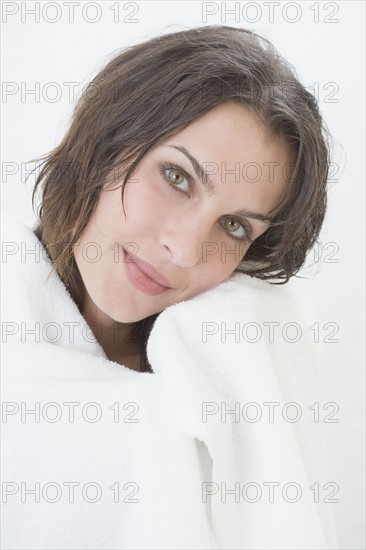 Portrait of woman wrapped in bath towel.