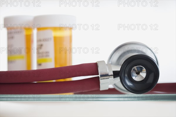 Close up of stethoscope and medication.
