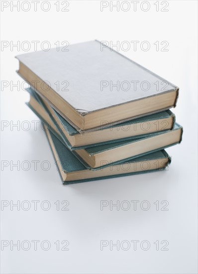 Close up of stack of books.