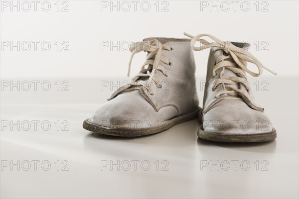 Close up of old fashioned baby shoes.