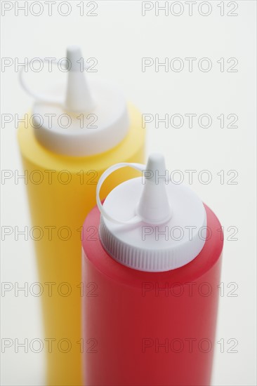 Close up of ketchup and mustard bottles.