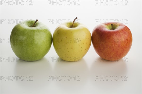 Assorted apples in a row.