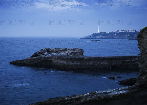Scenic view of cliffs and lighthouse, Biarritz, France.