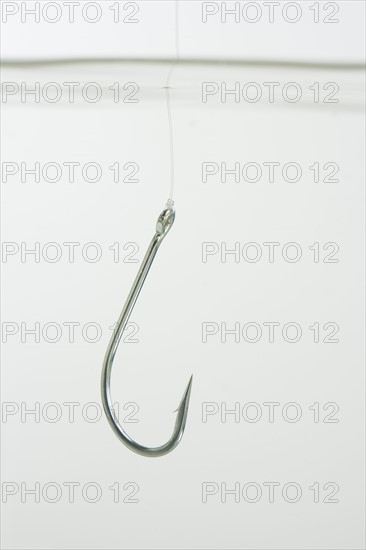 Close up of fish hook in water.