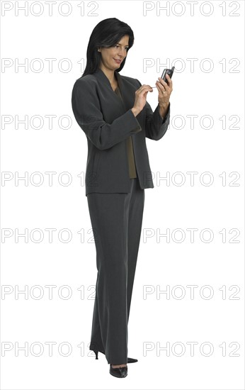 Businesswoman looking at cell phone.