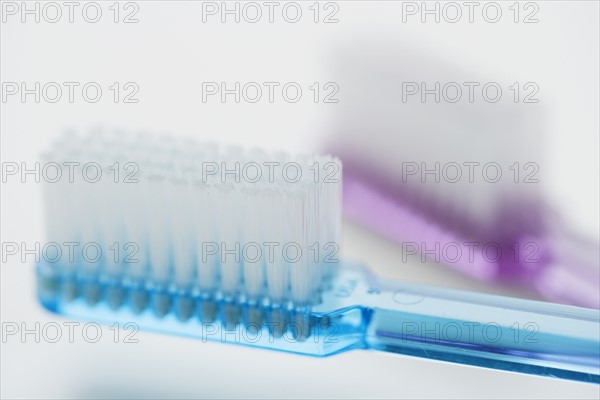 Close up of toothbrushes.
