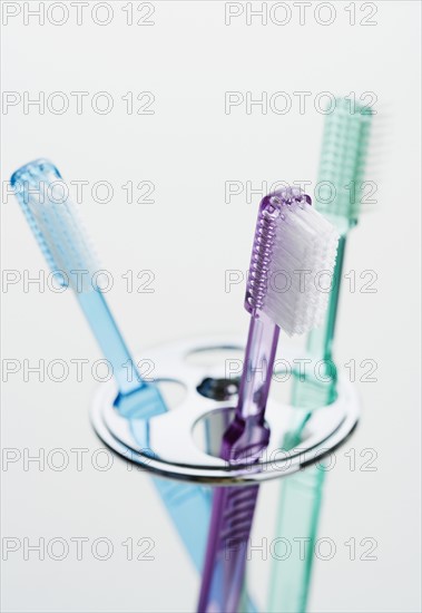 Close up of toothbrushes.