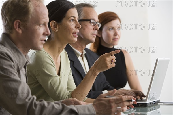 Businesspeople at meeting.