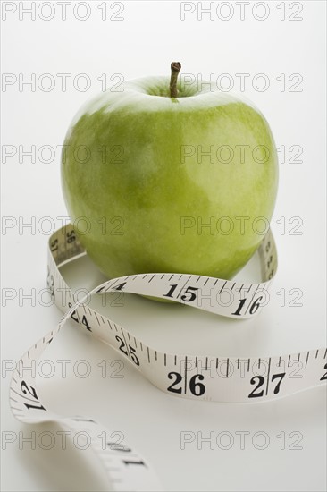 Apple and tape measure.