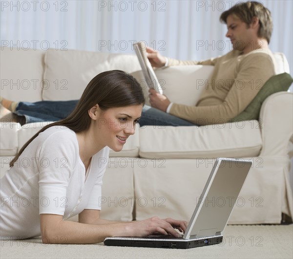 Couple relaxing in livingroom.