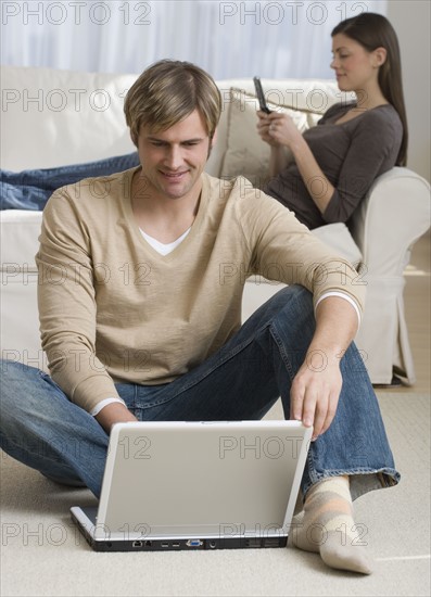 Couple relaxing in livingroom.