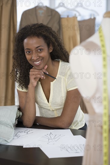 Portrait of seamstress in shop.