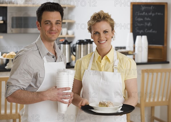 Portrait of wait staff in cafe.