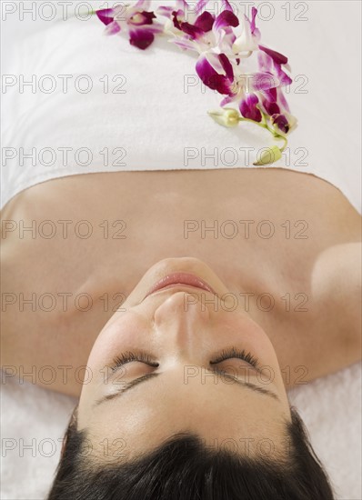 Woman laying on spa table.