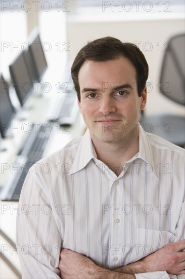 Businessman with arms crossed.