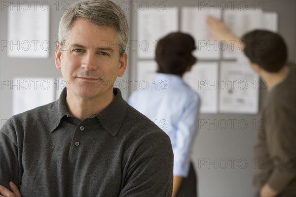 Businessman with arms crossed.