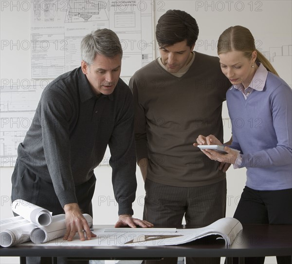 Businesspeople in architect’s office.