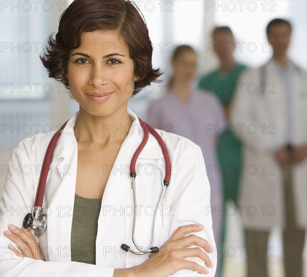 Female doctor with arms crossed.