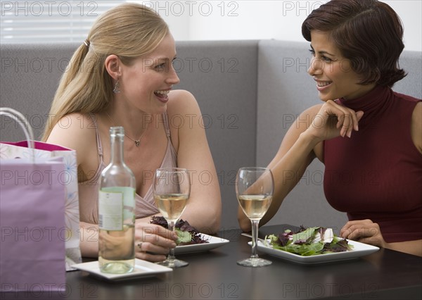 Two women eating lunch at restaurant.