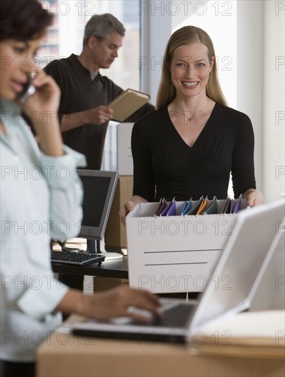 Businesspeople working in new office.