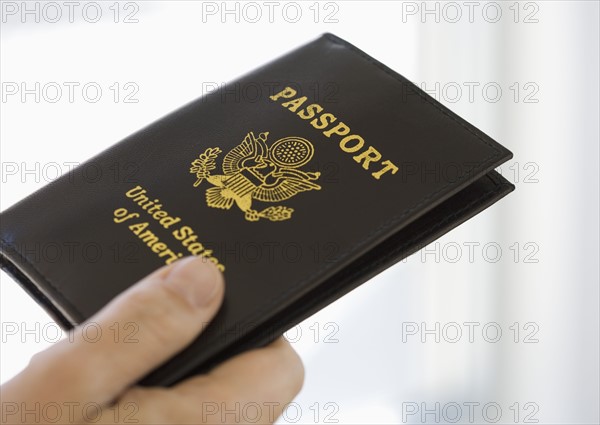 Man holding passport.
