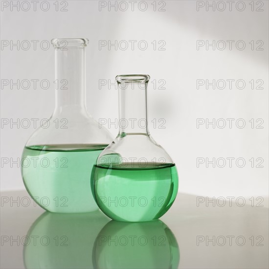 Two beakers with liquid.