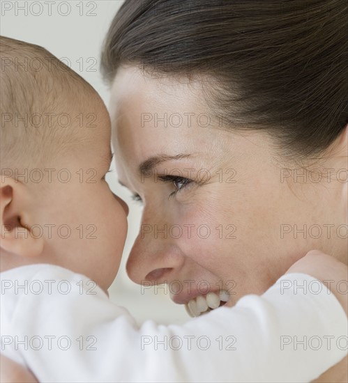 Mother smiling at baby.