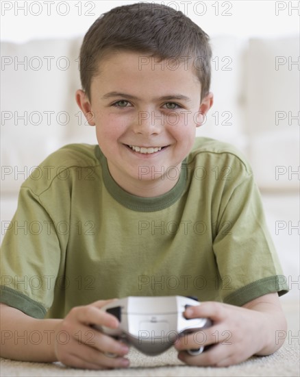 Boy holding video game controller.