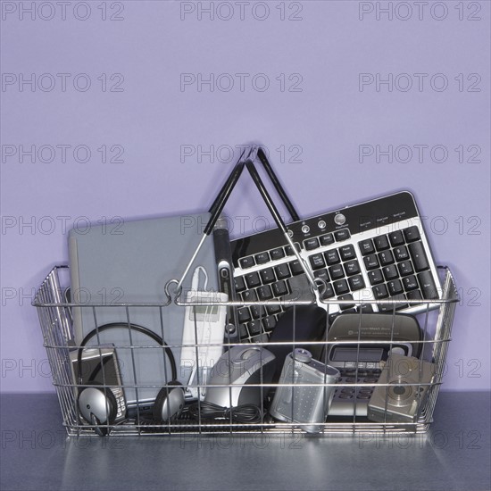 Shopping basket filled with electronics.