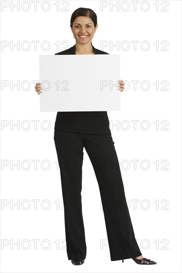 Indian businesswoman holding blank sign.