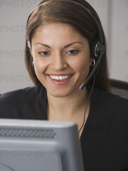 Indian businesswoman wearing headset.